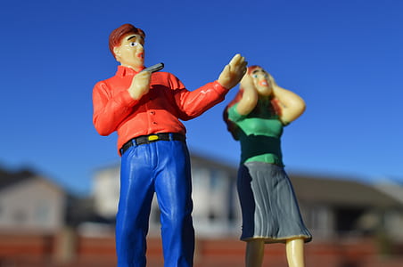 depth of field photography of man and woman figurines thumbnail