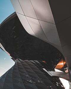 low angle photography of white concrete building during daytime thumbnail