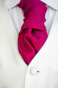 closeup photo of white suit jacket and pink necktie thumbnail