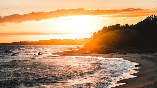 waves on beachfront during sunset thumbnail