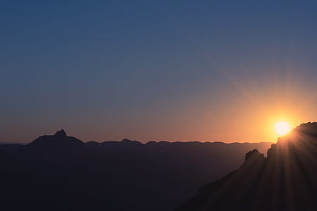 silhouette of mountain during sunset thumbnail