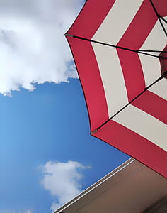 low angle photo of red and white umbrella thumbnail