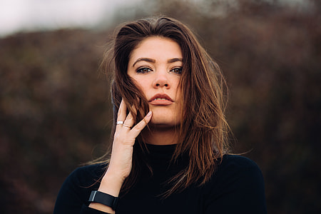 selective focus photography of woman in black shirt thumbnail