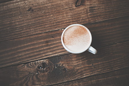 white ceramic mug with coffee latte on brown wooden surface thumbnail