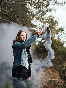 woman holding smoking device thumbnail