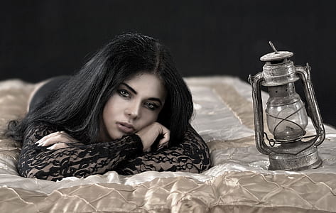 woman laying on bed near cold blast lantern thumbnail
