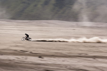 person riding on motocross dirt motorcycle during daytime thumbnail