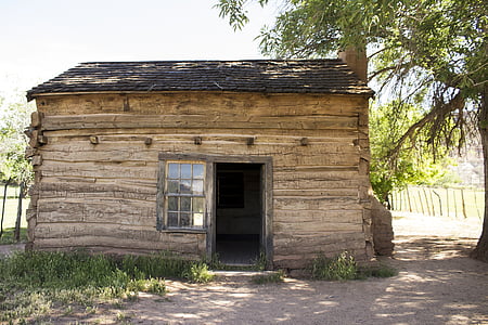brown and black wooden house with tree on side thumbnail