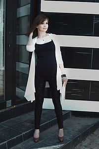 woman wearing white cardigan while taking selfie thumbnail