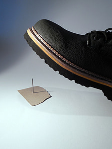 black leather shoe about to step white pin thumbnail
