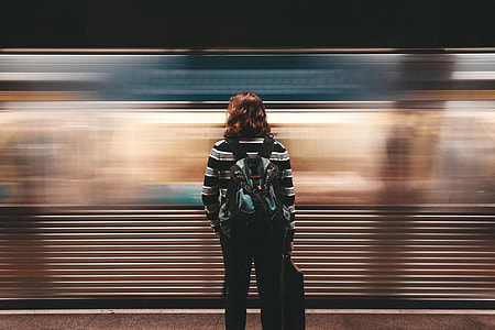 woman standing in front of moving train thumbnail