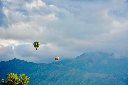 two assorted-color hot air balloons thumbnail