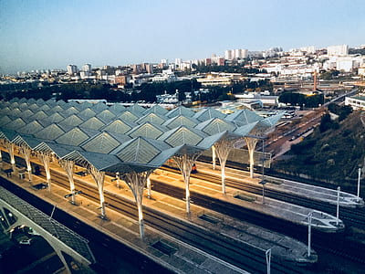 photo of grey and white train station during golden hour thumbnail