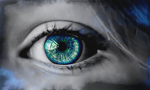 photo of girl's eye with green and blue pupil in gray-scale photography thumbnail