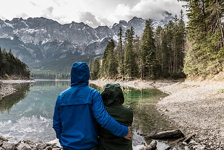 man and woman standing near the river thumbnail