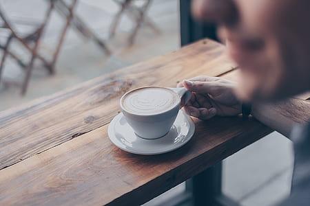 man holding cup of coffee thumbnail