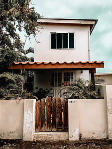 white 2-storey house beside tree thumbnail