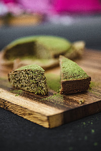 Delicious homemade matcha cake on a wooden board thumbnail