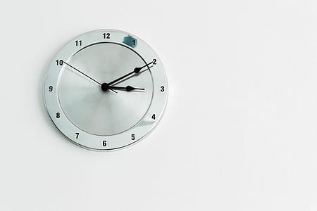 round white analog wall clock at 3:10 thumbnail