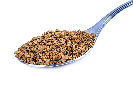spoon full of brown grains thumbnail