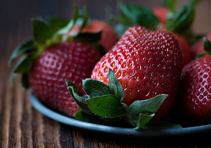 macro photography of strawberries on top of gray plate thumbnail