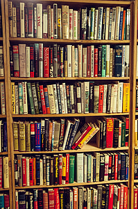 book lot on brown wooden rack thumbnail