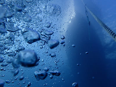 photo of bubbles underwater with boat above thumbnail