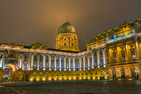low angle photography of white building during night time thumbnail