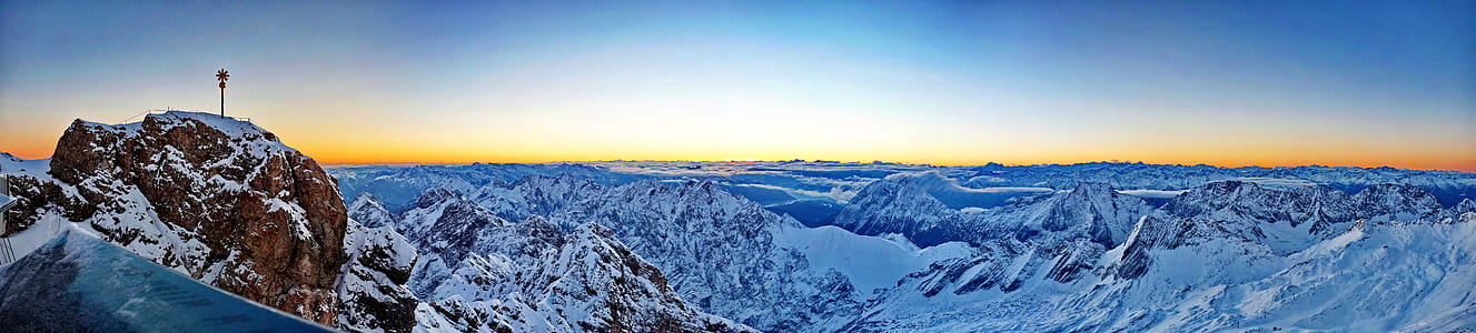 mountain covered with snow during daytime thumbnail
