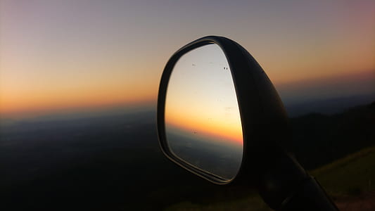 left vehicle side mirror viewed during golden hour thumbnail