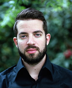 man wearing black collared shirt thumbnail