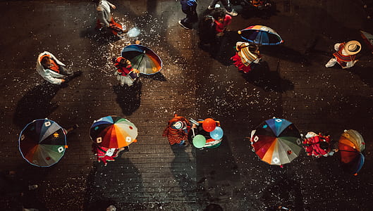 people using umbrella on road thumbnail