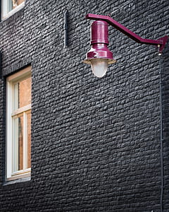 purple sconce outside building thumbnail