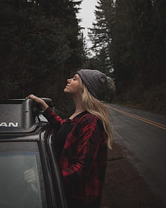 man facing sideways riding on vehicle thumbnail