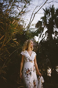 woman looking side in white dress thumbnail