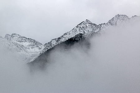 mountain filled with snow during daytime thumbnail