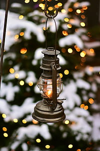 gray kerosene lamp hanged on black metal hook thumbnail