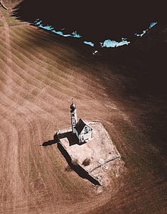 white concrete house on sand thumbnail