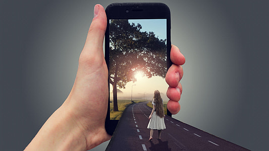 person holding turned on black iPhone 7 thumbnail