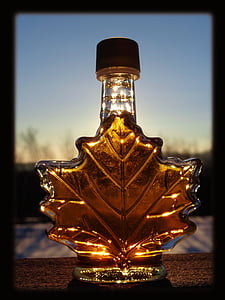 selective brown tinted glass leaf bottle at daytime thumbnail