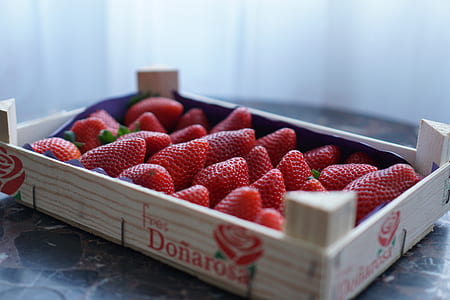 shallow focus photography of box of strawberries thumbnail
