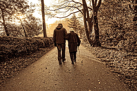 couple walking along concrete pathway thumbnail