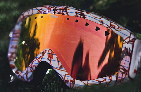 orange sports goggles with white frames thumbnail