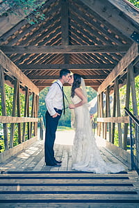 bride and groom on hallway during daytime thumbnail
