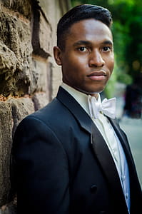 Selective Focus Photography of Man in Black Suit thumbnail