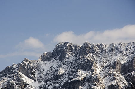 snow covered mountain under blue sky thumbnail