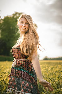 Woman in Brown-and-blue Dress Standing in Wheat Field thumbnail
