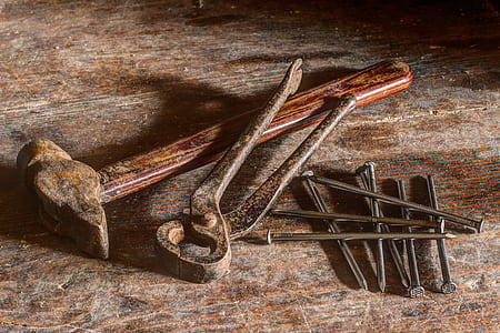 brown hammer, black tong, and gray nails thumbnail