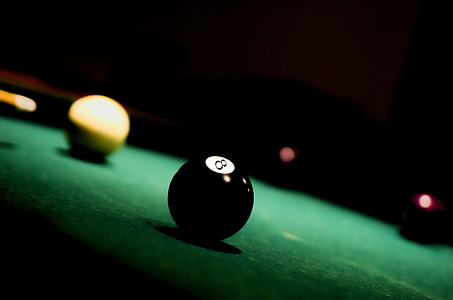 shallow focus photography of black #8 billiard ball thumbnail