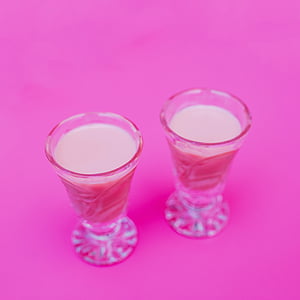 two pink beverages on pink surface thumbnail